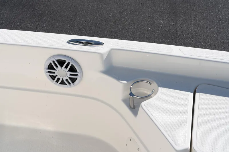 Slide: The Image of 2024 Skeeter SX 210 boat interior with speaker and cup holder. - 15
