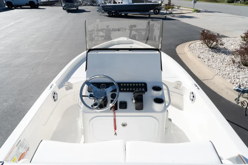 Slide: The Image of 2024 Skeeter SX 210 boat cockpit with steering wheel and control panel. - 6