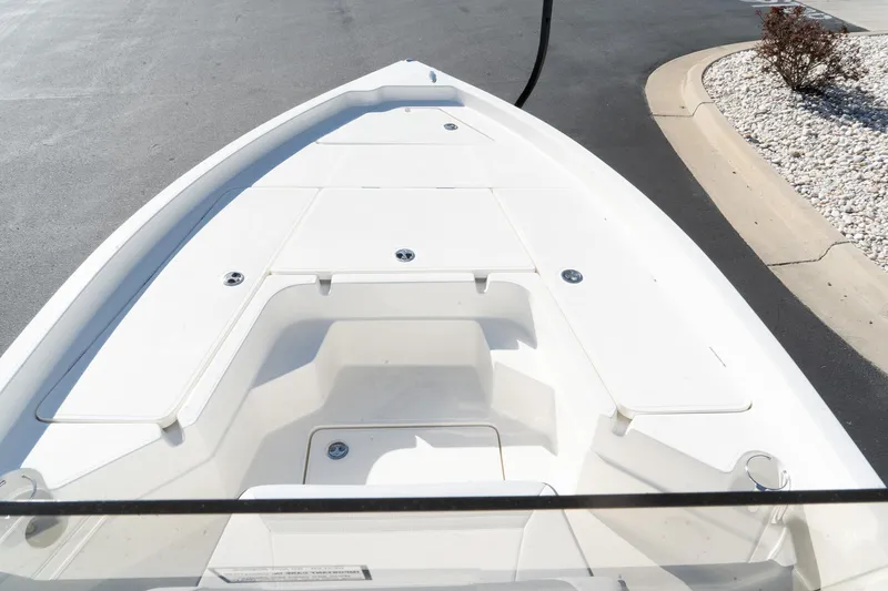 Slide: The Image of 2024 Skeeter SX 210 boat bow with white deck and storage compartments. - 9