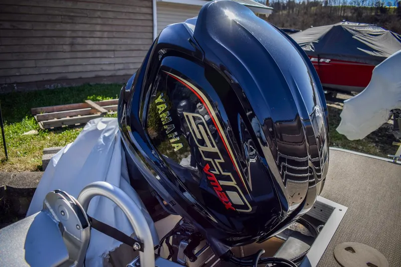 Slide: The Image of 2024 Bennington 22 LSB with Yamaha VMAX outboard engine, sleek black design. - 10