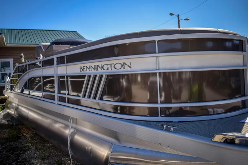 Slide: The Image of 2024 Bennington 22 LSB pontoon boat with sleek design and modern features. - 11