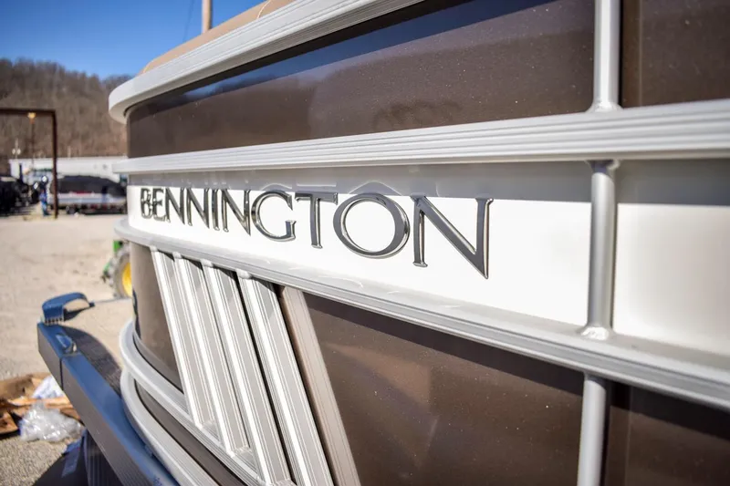 Slide: The Image of Close-up of 2024 Bennington 22 LSB boat logo and design details. - 13