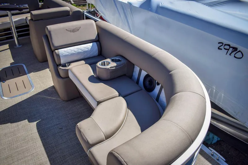 Slide: The Image of 2024 Bennington 22 LSB boat interior with plush seating and cup holders. - 3