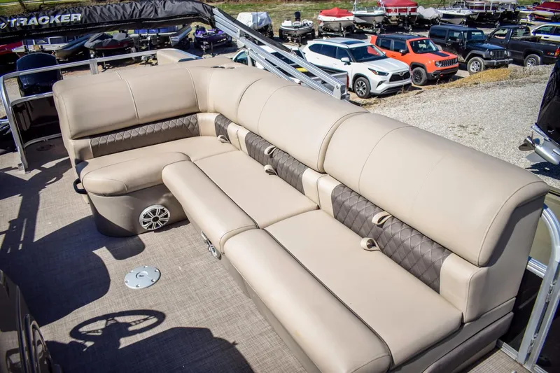 Slide: The Image of 2023 Sun Tracker Sportfish 24 XP3 pontoon boat with beige seating. - 10