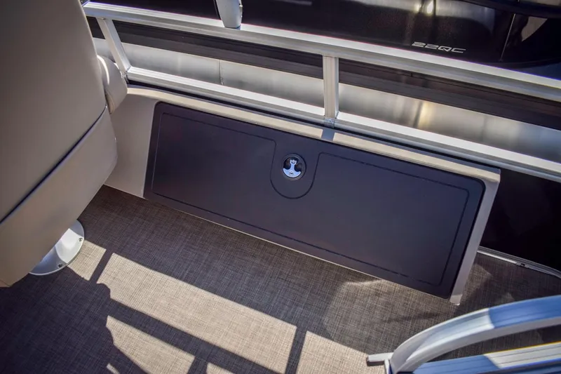 Slide: The Image of 2023 Sun Tracker Sportfish 24 XP3 storage compartment on deck. - 15