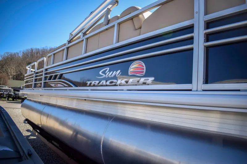 Slide: The Image of 2023 Sun Tracker Sportfish 24 XP3 pontoon boat side view. - 3