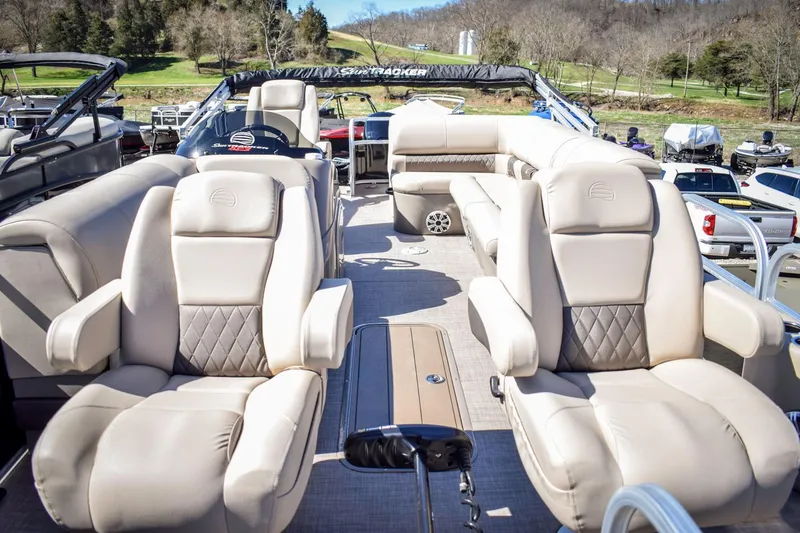 Slide: The Image of 2023 Sun Tracker Sportfish 24 XP3 pontoon boat interior with luxurious seating. - 5