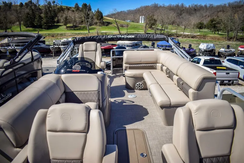 Slide: The Image of 2023 Sun Tracker Sportfish 24 XP3 pontoon boat with spacious seating and modern design. - 6