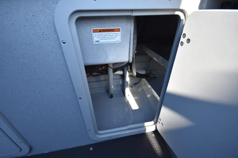 Slide: The Image of Open compartment in 2025 Weldcraft 280 Cuddy King boat showing internal components. - 12