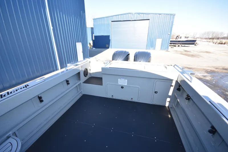 Slide: The Image of 2025 Weldcraft 280 Cuddy King T250XCB boat deck with twin engines. - 16