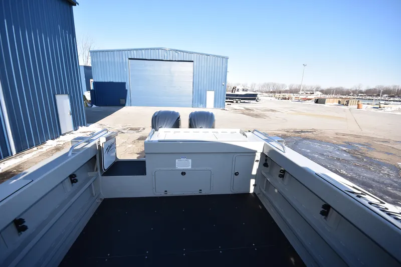 Slide: The Image of 2025 Weldcraft 280 Cuddy King T250XCB boat at a dockyard with twin engines. - 22