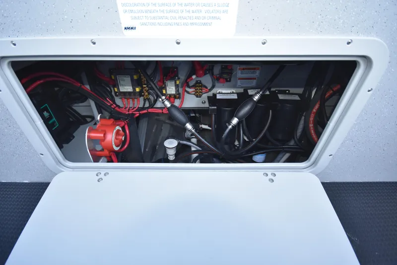 Slide: The Image of Weldcraft 280 Cuddy King T250XCB 2025 engine compartment with wiring and components. - 23