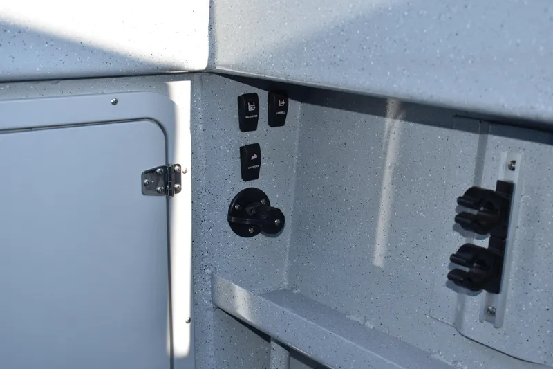 Slide: The Image of Control panel and storage compartment of 2025 Weldcraft 280 Cuddy King T250XCB boat. - 27