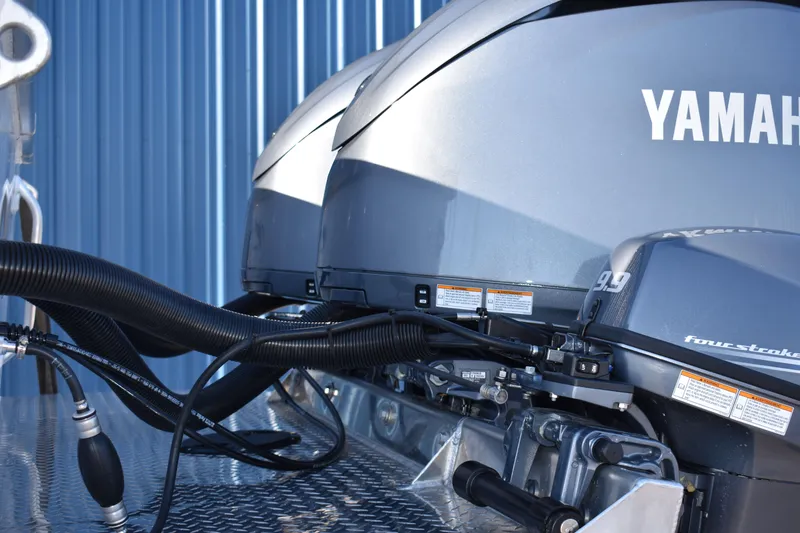Slide: The Image of Close-up of Yamaha outboard motors on a 2025 Weldcraft 280 Cuddy King boat. - 30