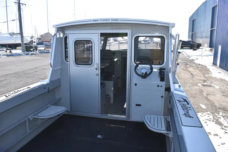 Slide: The Image of 2025 Weldcraft 280 Cuddy King boat exterior with cockpit view. - 31