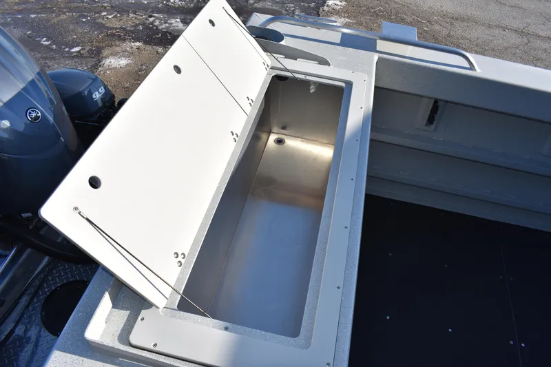 Slide: The Image of Open storage compartment on a 2025 Weldcraft 280 Cuddy King boat. - 33