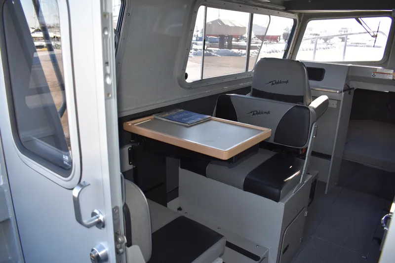 Slide: The Image of 2025 Weldcraft 280 Cuddy King T250XCB interior cabin with seating and table. - 37