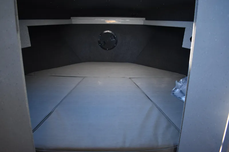 Slide: The Image of 2025 Weldcraft 280 Cuddy King T250XCB's cabin interior with cushioned sleeping area. - 42