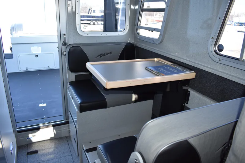 Slide: The Image of Interior of 2025 Weldcraft 280 Cuddy King T250XCB boat with seating and table. - 43