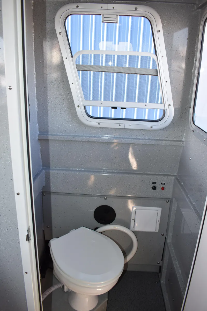 Slide: The Image of 2025 Weldcraft 280 Cuddy King T250XCB's On Order boat interior bathroom with window. - 45