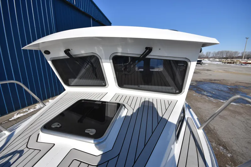 Slide: The Image of 2025 Weldcraft 280 Cuddy King T250XCB boat deck and cabin windows. - 6