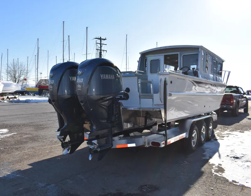 Slide: The Image of 2025 Weldcraft 280 Cuddy King T250XCB boat with twin Yamaha engines on trailer. - 8
