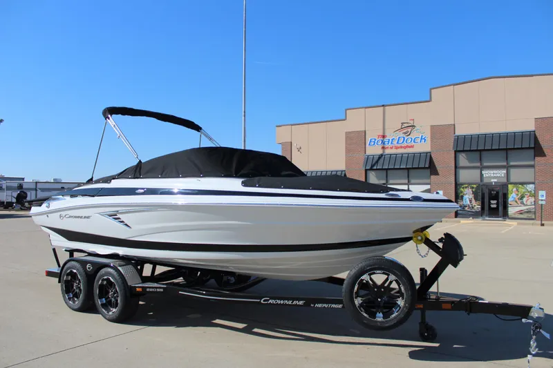 Slide: The Image of 2024 Crownline 220 SS boat on trailer outside dealership. - 10