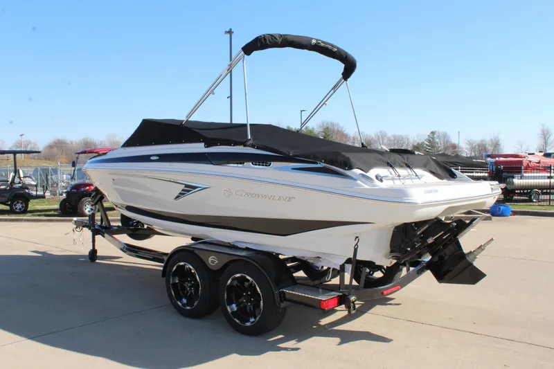 Slide: The Image of 2024 Crownline 220 SS boat on trailer, covered and ready for transport. - 13
