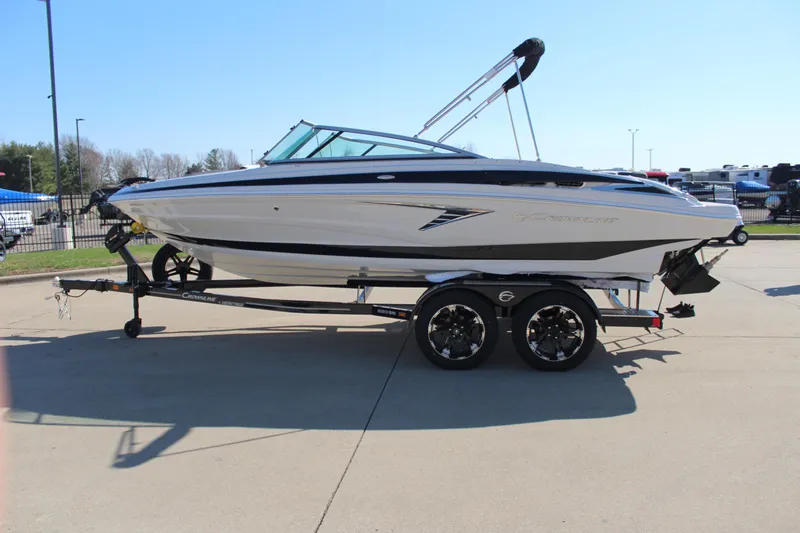 Slide: The Image of 2024 Crownline 220 SS boat on trailer, side view. - 16