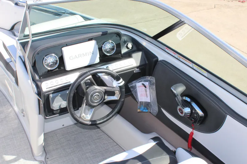 Slide: The Image of 2024 Crownline 220 SS boat dashboard with Garmin navigation system. - 5