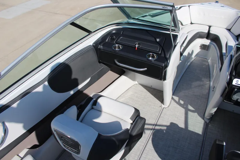 Slide: The Image of 2024 Crownline 220 SS boat interior with seating and dashboard. - 6