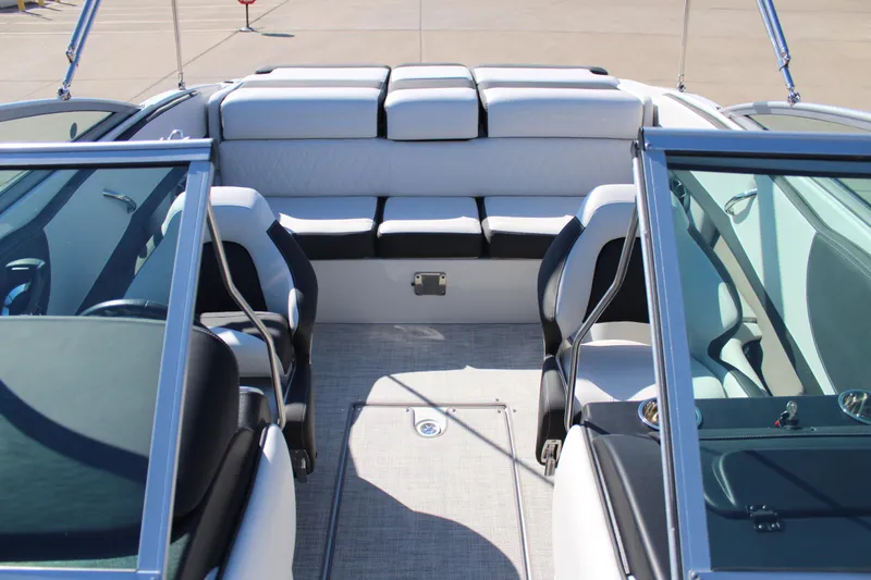 Slide: The Image of 2024 Crownline 220 SS boat interior with white and black seating. - 7