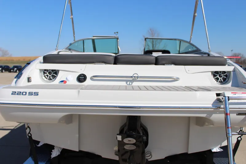 Slide: The Image of 2024 Crownline 220 SS boat rear view with dual seats and outboard motor. - 9