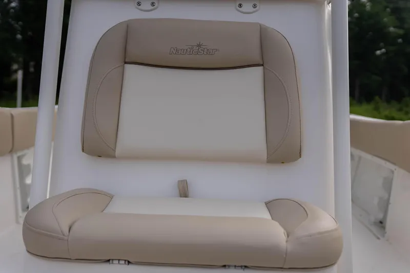 Slide: The Image of NauticStar 2102 Legacy 2022 boat seat, beige and white upholstery. - 14