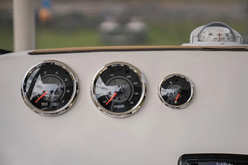 Slide: The Image of NauticStar 2102 Legacy 2022 dashboard with speedometer and gauges. - 17