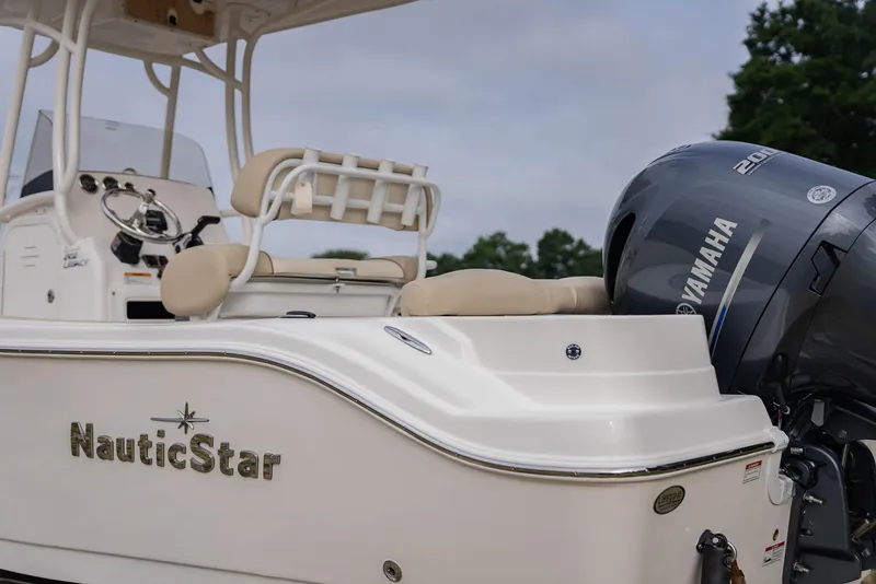 Slide: The Image of 2022 NauticStar 2102 Legacy boat with Yamaha engine, side view. - 21