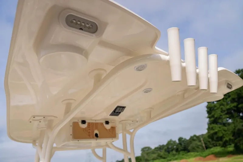 Slide: The Image of 2022 NauticStar 2102 Legacy boat canopy with rod holders and lighting. - 8