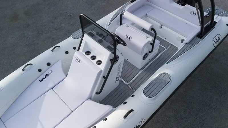 Slide: The Image of 2025 Aqvaboats Luxrib 22 inflatable boat with white seating and modern console. - 20