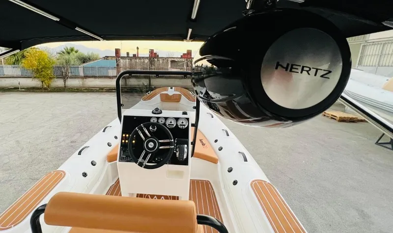 Slide: The Image of Aqvaboats Luxrib 22, 2025 model, featuring a sleek interior and advanced controls. - 5