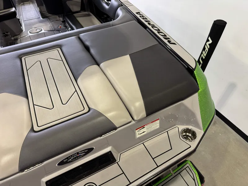 Slide: The Image of Interior of a 2021 Moomba Max boat, gray and green upholstery. - 11