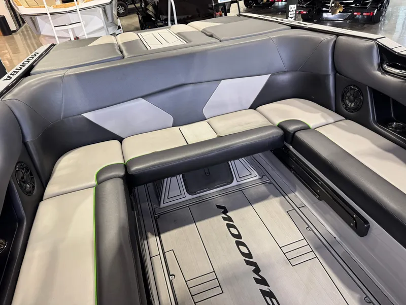 Slide: The Image of Interior of a 2021 Moomba Max boat with gray seating. - 16