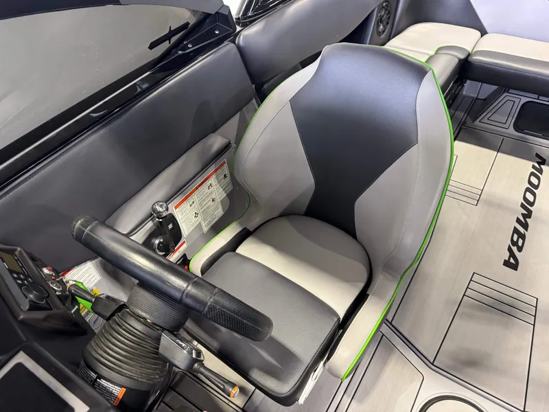 Slide: The Image of Interior of a 2021 Moomba Max boat with steering seat. - 21