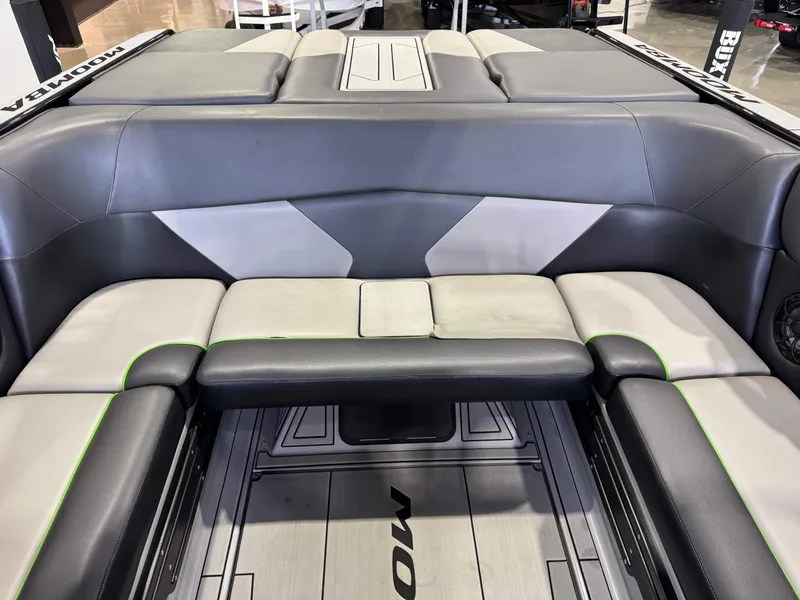 Slide: The Image of Interior of a 2021 Moomba Max boat with gray and green seating. - 27
