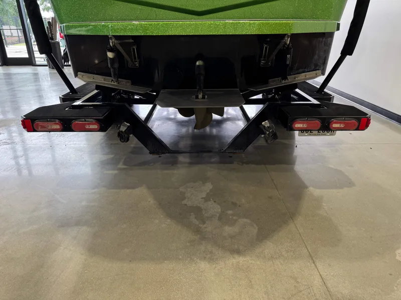 Slide: The Image of Rear view of a 2021 Moomba Max boat on a trailer. - 7