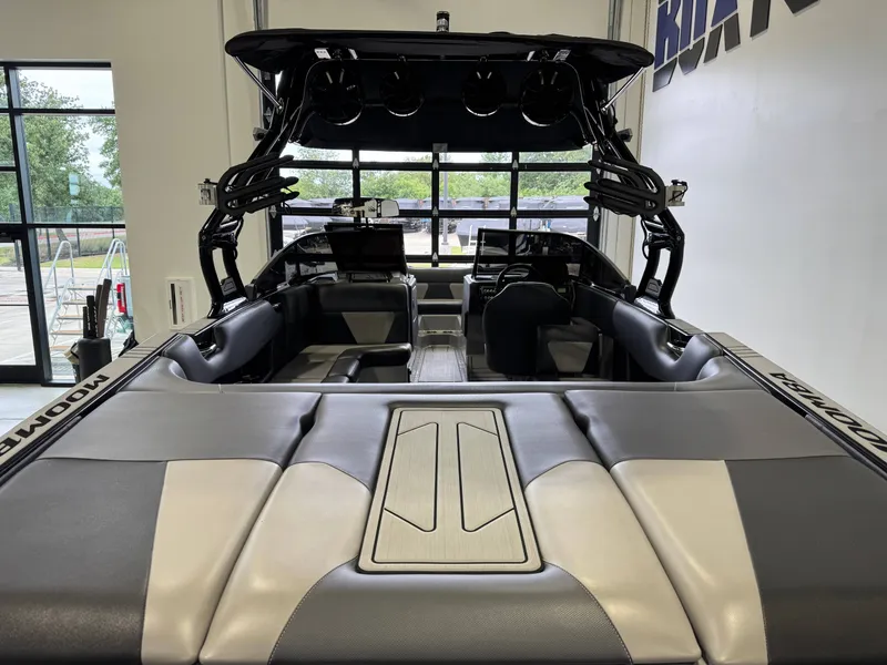 Slide: The Image of Interior view of a 2021 Moomba Max boat in a showroom. - 9