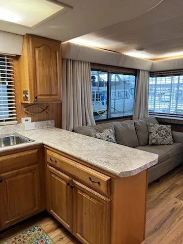 Slide: The Image of Interior of 2001 Monticello River Yacht with kitchen and seating area. - 13