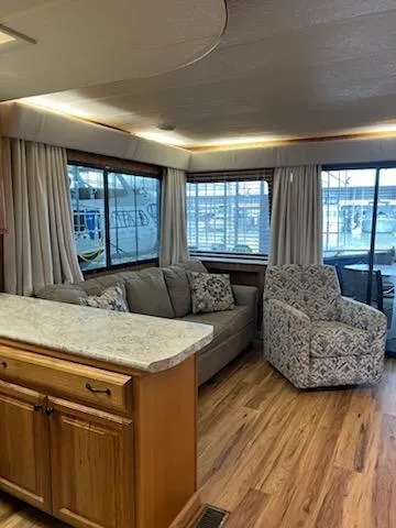 Slide: The Image of Interior of 2001 Monticello River Yacht with cozy seating and large windows. - 14