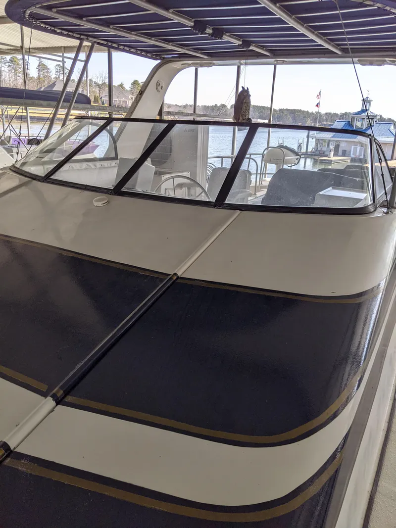 Slide: The Image of 2001 Monticello River Yacht docked under a covered marina. - 2