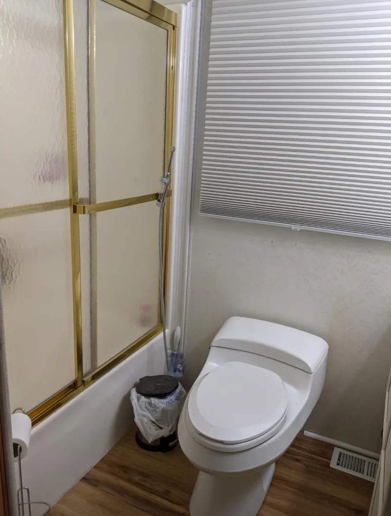 Slide: The Image of 2001 Monticello River Yacht bathroom with shower and toilet. - 27