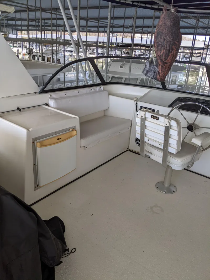Slide: The Image of 2001 Monticello River Yacht interior with seating and control area. - 36
